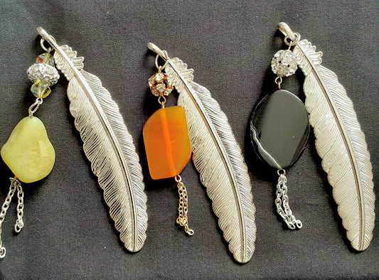 Elegant feather bookmarks adorned with natural stones and subtle sparkle.