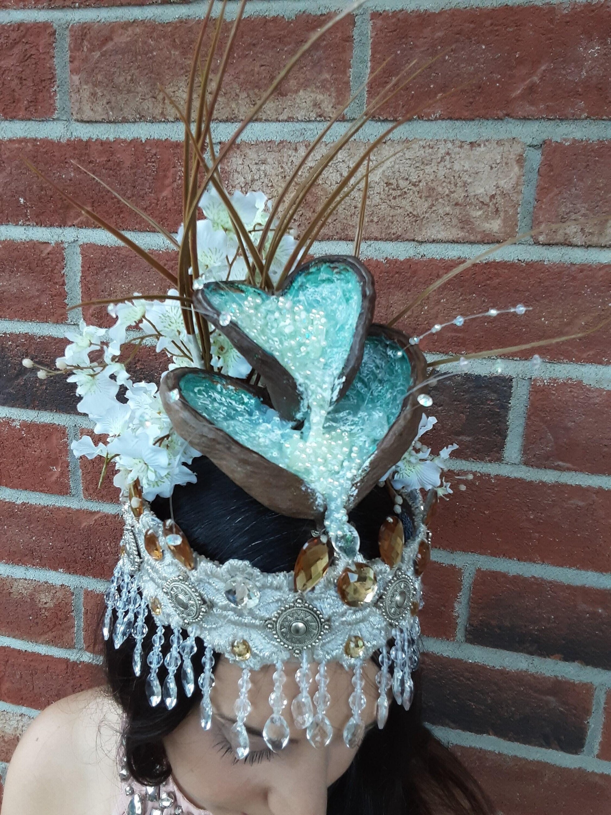 A sculptural crown featuring a cascading design flowing through layered coconut shells.