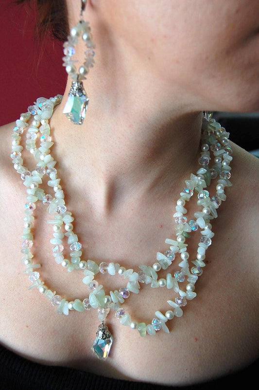 A luminous layered set featuring white jade, citrine, and faceted crystal accents.